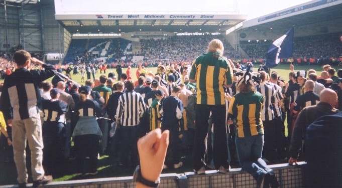 The players salute the fans...well, they're there somewhere!