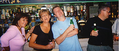 While Susan, Moira and Dave are posing, Ian is talking to a complete stranger.